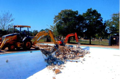 Building a ramp to get the Backhoe down in the pool.